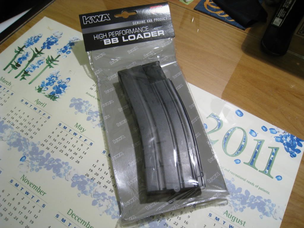 http://i8.photobucket.com/albums/a1/aznriptide859/Airsoft/KWA Magazine Speed Loader/IMG_1373.jpg